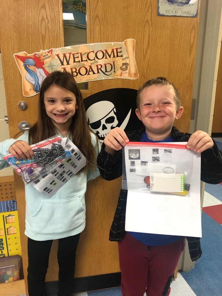 Dean and Bella sharing their packing slip showing their purchased prizes  